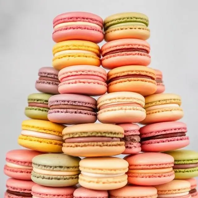 A towering display of colorful French macarons.