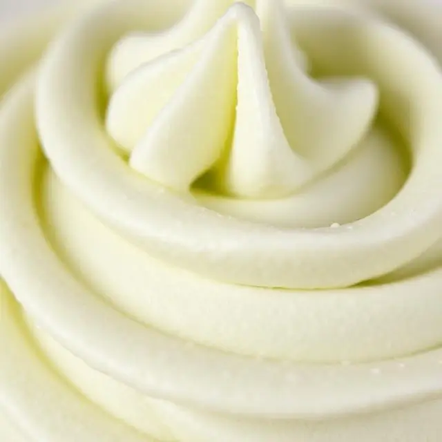 A detailed close-up shot of textured buttercream frosting.